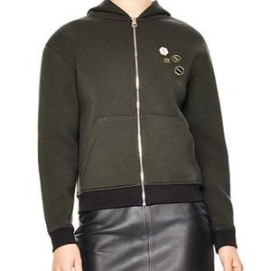 Sandro green hoodie with enamel embellishment and zip closure